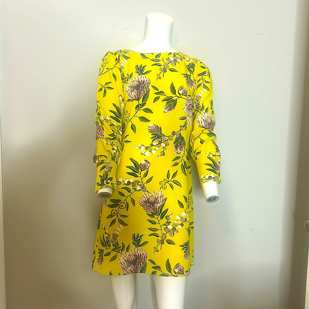 Selling a bright yellow dress… only used 1 time!